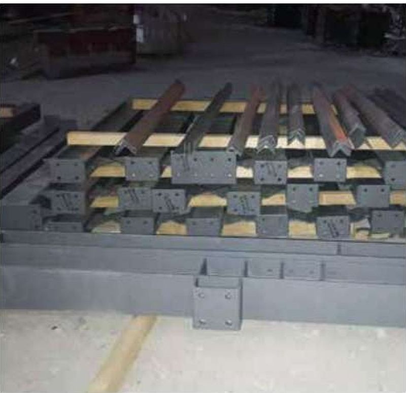 Fabricated base plates with holding-down bolt groups and templates