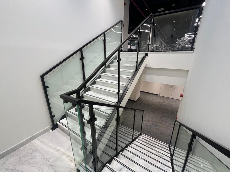 Handrail with glass partition infill